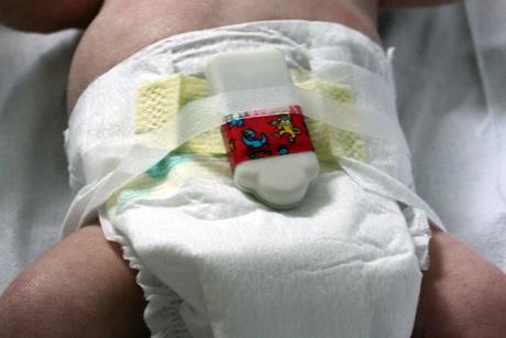 Baby measurement device, attached to a nappy