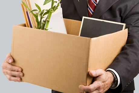 Man holding a box of office belongings