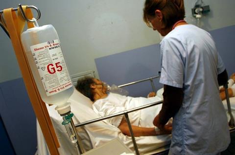 A patient lying in a hospital bed