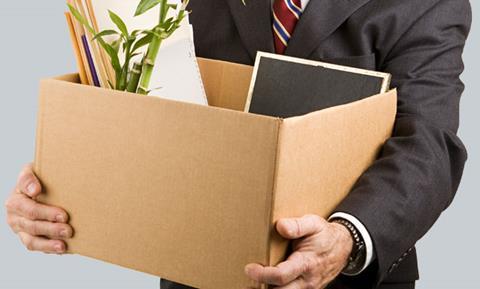 Man holding a box of office belongings