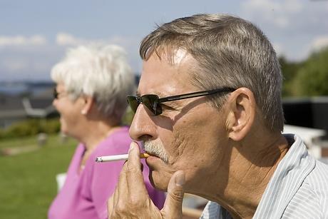 An elderly man smoking