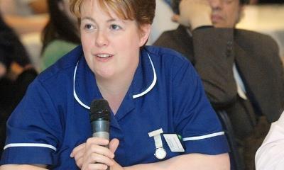 Nurse with microphone at LIA event