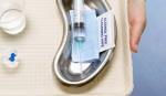 Medical tray with syringe, pills and water