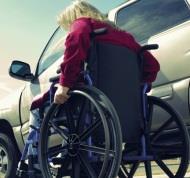 Wheelchair woman and car