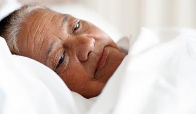 Elderly woman in bed