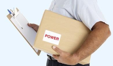 Man holding box and clipboard. The box says power on the label