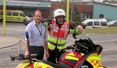 Barry Rigg, Community Engagement Manager, UHMBT, and Paul Brooks, Chairman, North West Blood Bikes Lancashire and Lakes