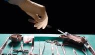 Surgeons hand reaching for scalpel