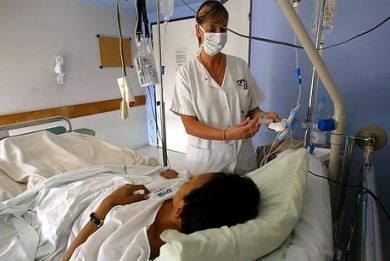 Nurse with patient and IV drip