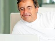 Man in bed using laptop