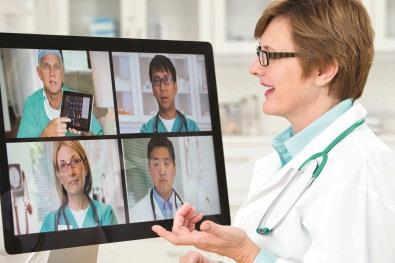Multidisciplinary team working doctors tablets technology