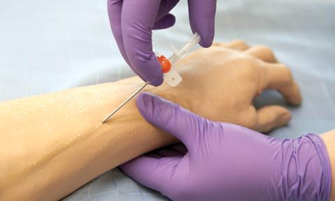 Injecting a rubber hand for doctors' training