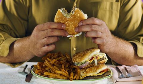 Man eating junk food