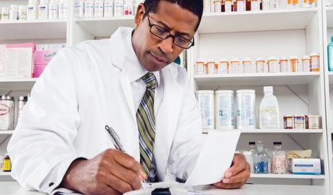 Pharmacist writing