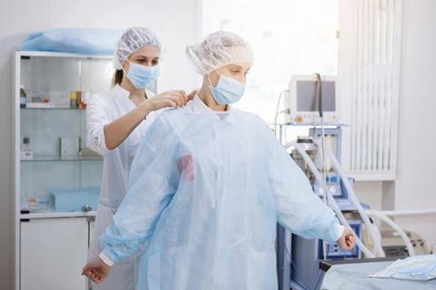 Doctor in hopsital gown PPE