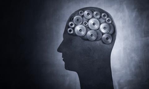 Conceptual image of head filled with cog gears