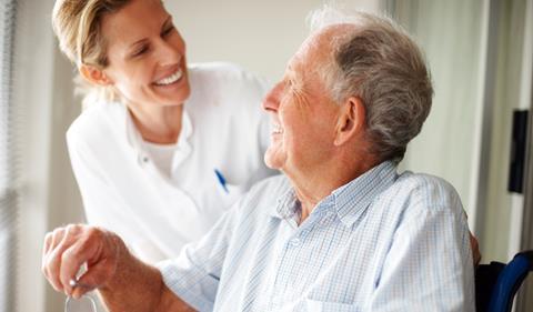 Patient and health worker smiling at each other