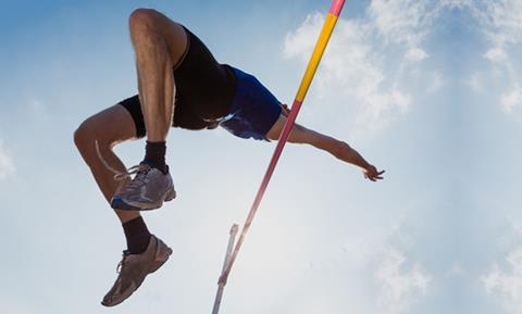 A man leaping over the high jump