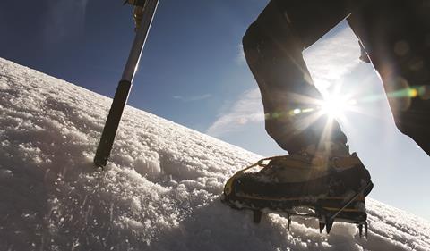 Climber on snowy mountain