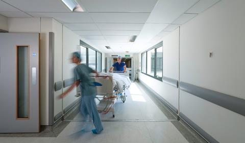 Hospital staff rushing with patient