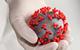 Coronavirus in gloved hand