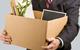 Man holding a box of office belongings